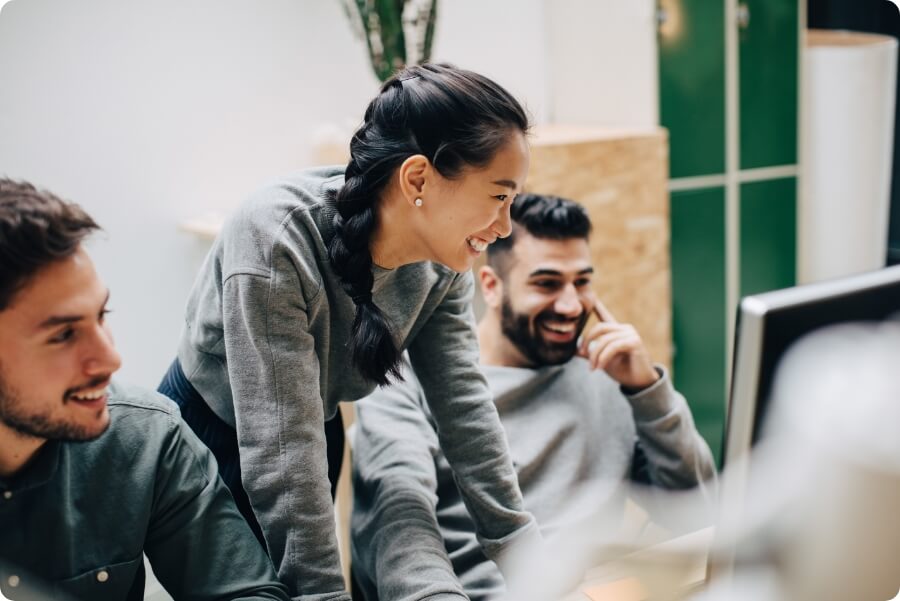 Brokers looking at computer